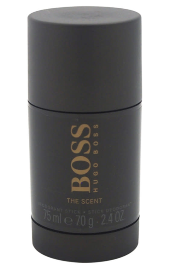 A Hugo Boss deodorant stick in a matte black cylindrical container with gold lettering, labeled 'BOSS HUGO BOSS THE SCENT' and '75 ml e 70 g - 2.4 OZ', on a plain white background.