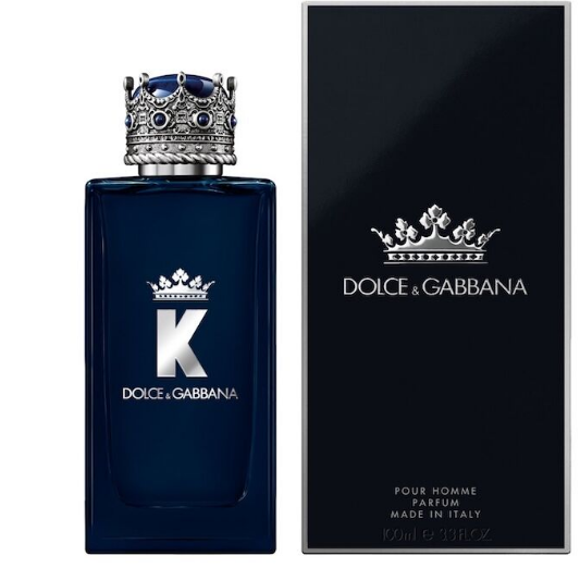 Dolce & Gabbana K Pour Homme perfume bottle in dark blue glass with a silver crown cap, shown next to its black packaging box featuring a silver crown logo.