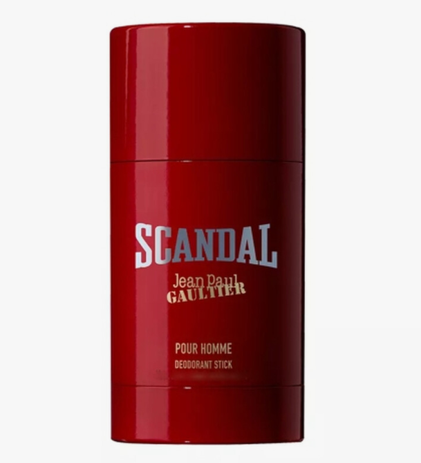 A red deodorant stick container with 'SCANDAL Jean Paul Gaultier' printed on the front, set against a plain light gray background.