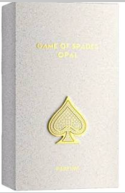 A square product box with a textured off-white surface, featuring gold foil text reading 'GAME OF SPADES OF' at the top and a large gold spade symbol on the front.