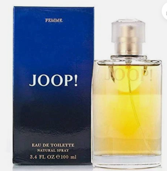 Joop! Femme Eau de Toilette perfume bottle with yellow liquid next to its blue box, on a white background.