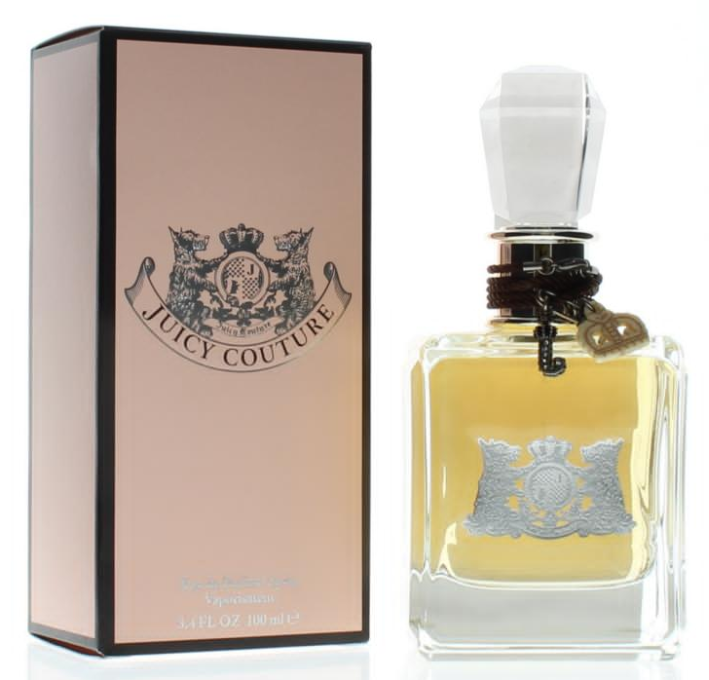Juicy Couture Sycamore Eau de Parfum bottle next to its pink packaging box, featuring a silver crest logo and a white stopper.