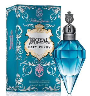 Katy Perry Killer Queen's Royal Embroidery Eau de Parfum bottle and packaging box. The bottle is a faceted light blue crystal shape with a silver cap, standing next to its matching blue box decorated with silver and pink embroidery.