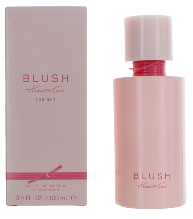 Blush by Kenzo Rose Gold Eau de Parfum spray bottle next to its matching pink packaging box, featuring a light pink bottle and cap with a metallic rose gold neck accent.