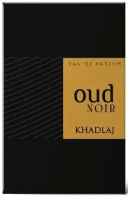A perfume box or packaging panel for 'oud noir' by Khadlaj, featuring a black background with a prominent mustard yellow label on the right side and thin diagonal gray lines on the left.
