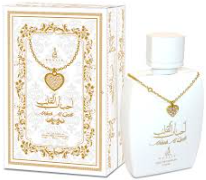 A white perfume bottle with a gold heart pendant necklace displayed alongside its ornate white and gold packaging box.