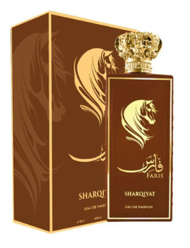 Sharqiyat Paris Eau de Parfum bottle and its matching box, both in a rich dark brown color with gold accents, featuring a stylized lion head logo and a gold crown on the bottle cap.