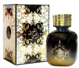 A 500ml bottle of Arabic perfume next to its ornate packaging box. The bottle is dark amber-brown with a metallic gold cap and gold Arabic calligraphy detailing.
