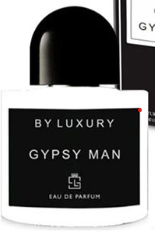 A bottle of Gypsy Man Eau de Parfum with a black cap and a white bottle body featuring a black label with white text. A second bottle is partially visible behind it on a black background.