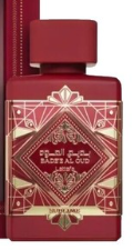 A red rectangular perfume bottle with a matching red cap, featuring ornate gold geometric patterns and Arabic script on the front label.