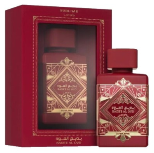A red and gold perfume gift set featuring a rectangular box with a clear window and a matching bottle, both labeled Sublime by Ramlion, on a plain white background.