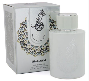 Musk Al Emarat Sharqiyat Eau de Parfum bottle and its matching white packaging box, featuring elegant Arabic calligraphy and gold geometric patterns.