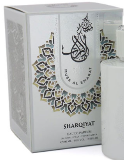 Sharqiyat Musal Emarat Eau de Parfum natural spray bottle and its white packaging box with gold and blue geometric patterns.