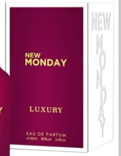 New Monday Luxury Eau de Parfum box packaging, featuring a deep magenta front panel with gold lettering and a white side panel with vertical gray text.