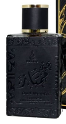 A dark textured perfume bottle with a black cap and gold trim, shown next to its matching black and gold box.