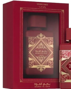 A red and gold perfume bottle displayed in front of its matching red gift box. The bottle features an ornate geometric gold pattern on a deep red background, with the text 'SOURI LICE' and 'BAKAR AL GOLD' visible.