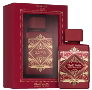 A red perfume gift set featuring a rectangular outer box with a clear window and a matching red perfume bottle in front, both decorated with ornate gold geometric patterns and Arabic text. The brand name 'SUBLIME' is visible at the top of the box.