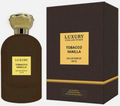 Luxury Collection Tobacco Vanilla Eau de Parfum bottle next to its retail box. The bottle is dark brown with a gold cap and a gold label, and the box is dark brown with a gold label.
