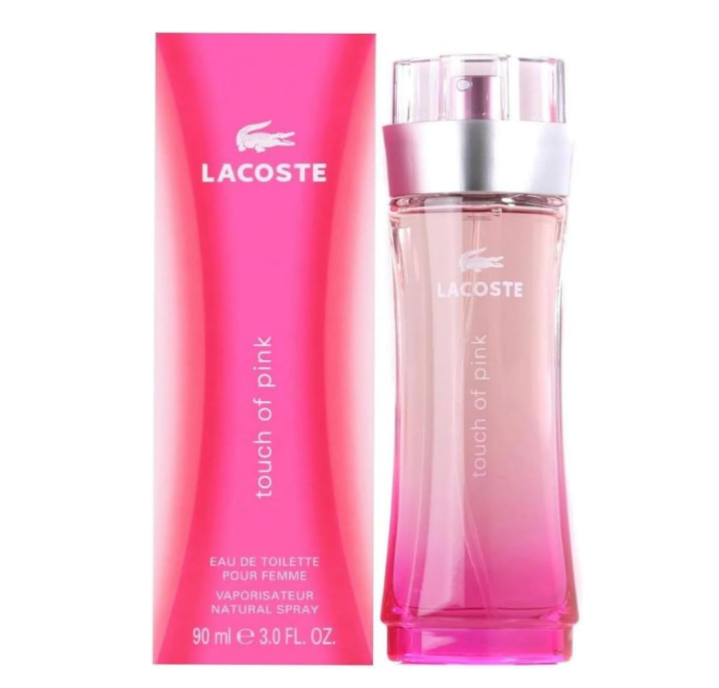 Lacoste Touch of Pink Eau de Toilette bottle and its pink packaging box, featuring a vibrant pink gradient design with a silver metallic collar on the bottle.
