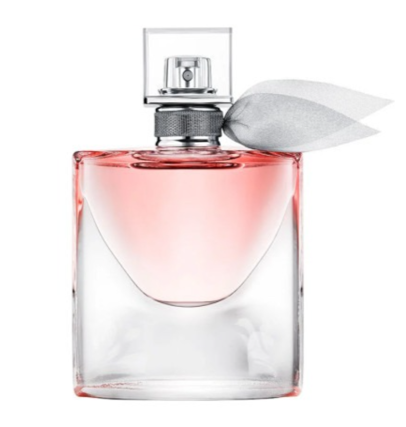 A clear glass perfume bottle with a pink gradient liquid, a silver spray mechanism, and a white satin ribbon tied to the neck, set against a plain white background.