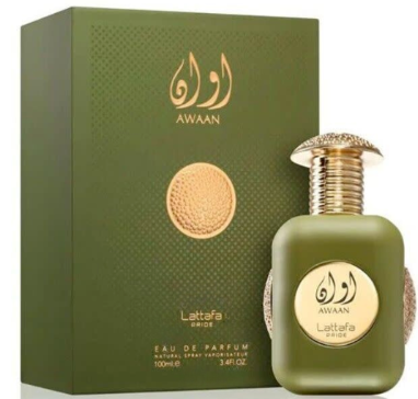A perfume bottle and its box for Lattafa Unisex 24 Carat Pure Gold EDP Spray. The packaging is dark brown with gold lettering and accents, and the bottle itself is gold with a rose gold-toned cap.