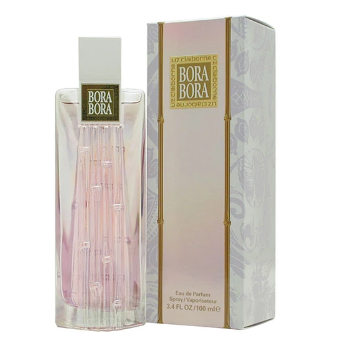 Bora Bora Eau de Parfum bottle and its packaging box, featuring a clear glass bottle with pink liquid and a white cap, next to a white and gold patterned box.
