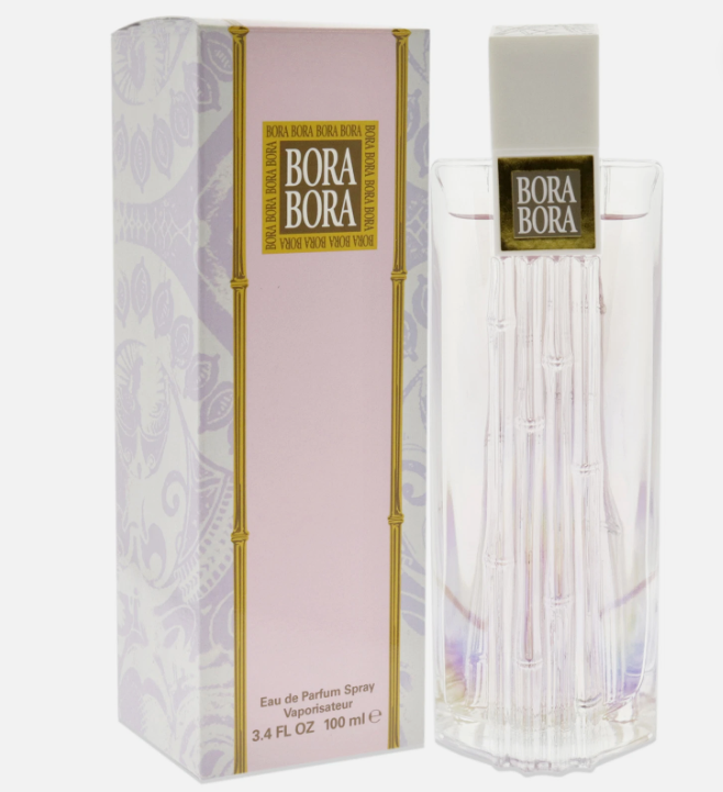 Bora Bora Eau de Parfum spray bottle next to its pink and white packaging box with gold bamboo accents.
