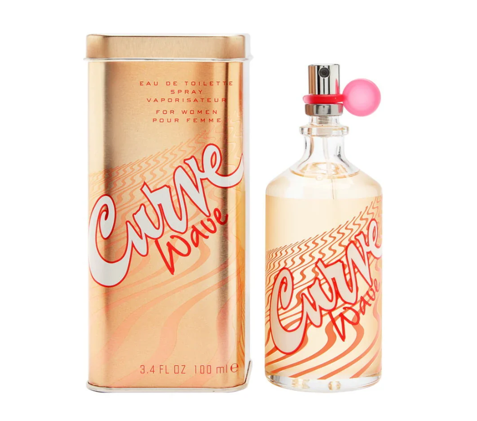 Curve Wave Eau de Toilette spray bottle and its metallic rose gold packaging box, featuring a pink spherical cap on the bottle and a pink and red graphic design.