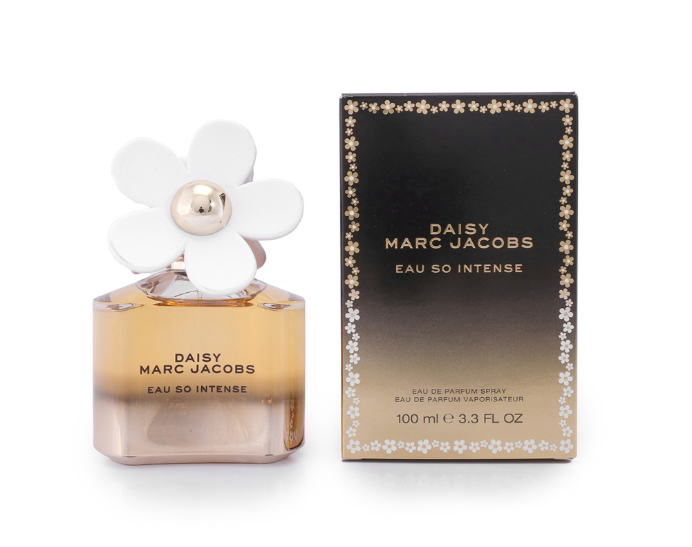 Marc Jacobs Daisy Eau So Intense perfume bottle with a white flower cap next to its black and gold packaging box on a white background.
