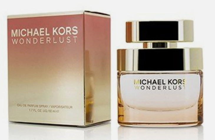 Michael Kors Wonderlust Eau de Parfum spray bottle next to its original gradient pink and gold packaging box, set against a clean white background.