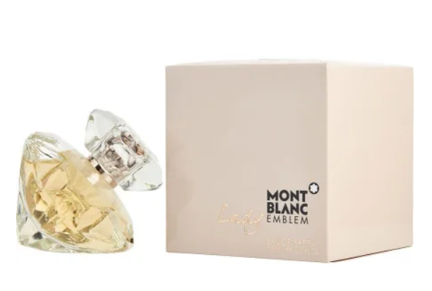 Mont Blanc Lady Eau de Parfum bottle with a faceted clear crystal design containing pale gold liquid, shown next to its cream-colored packaging box with the Mont Blanc Emblem logo.