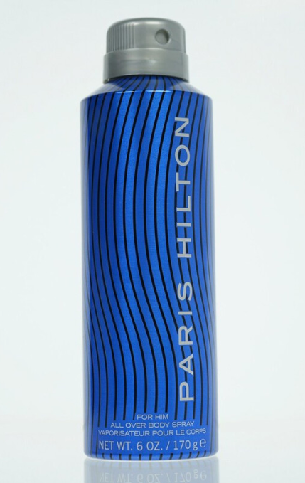 A 6 oz aerosol can of Paris Hilton All Over Body Spray for men, featuring a blue and black wavy striped design with a gray cap, on a white background.