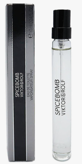 A clear glass perfume spray vial with a black spray top stands next to its black and silver rectangular box. The product label reads 'SPICEBOMB VIKTOR&ROLF'.