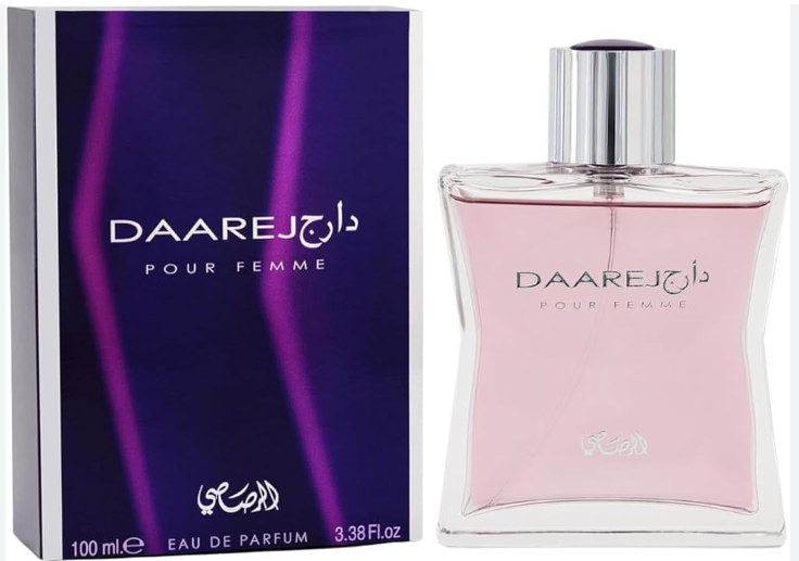 Daarej Pour Femme Eau de Parfum bottle and its packaging box. The bottle is clear glass containing a light pink liquid with a silver cap, next to its purple and black box with pink light graphics.