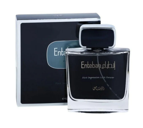 Entebate by Rubí perfume bottle with a black cap and dark label, shown in front of its matching black and silver box on a white background.