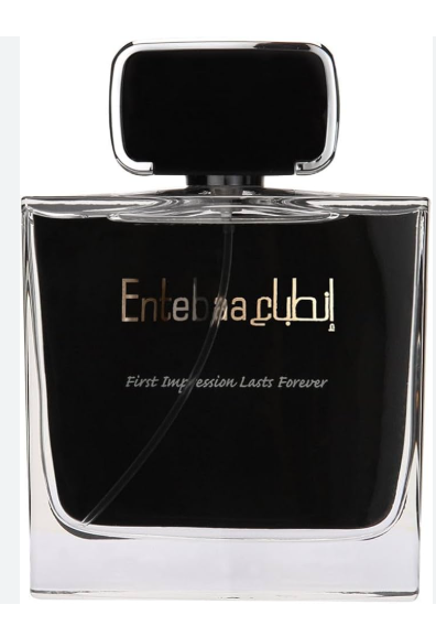 A rectangular glass perfume bottle with a black liquid and a black cap, featuring gold Arabic lettering and white English text that reads 'Enteb waqlil' and 'First Impression Lasts Forever'.