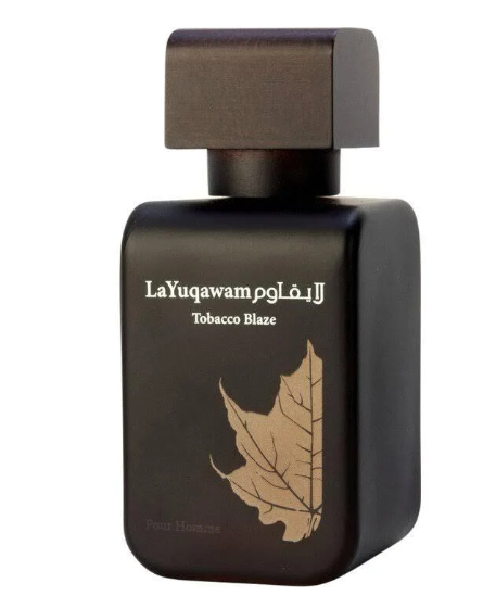 A dark brown rectangular perfume bottle with a matching cap, featuring white text that reads 'LaYuqawam Tobacco Blaze' and a gold maple leaf graphic on a white background.