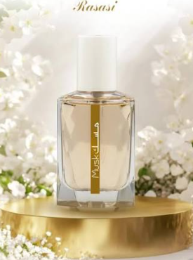 A rectangular glass perfume bottle with a white cap and a vertical gold label reading Muskil, displayed on a round gold pedestal with soft white flowers in the background. The brand name Kasasi appears at the top.