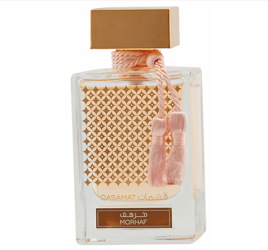 Morhaf Casamat perfume bottle with a gold cap, pink tassel, and patterned gold front panel on a white background.