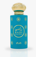 A turquoise blue cylindrical perfume bottle with a ribbed gold cap, featuring gold Arabic calligraphy and the brand name 'RADI' on the front, set against a light gray background with a soft reflection.