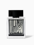 A rectangular clear glass perfume bottle with a black cap and a black-and-white zebra graphic on the front, photographed on a light gray background.