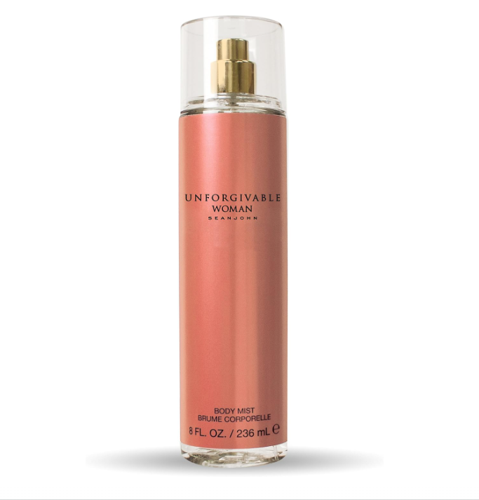 A bottle of Jean Paul brand 'Unforgivable Woman' body mist in a peach-pink color with a gold spray nozzle and clear cap, set against a plain white background.