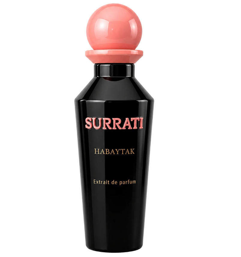 A bottle of Surrati Habaytak Extrait de Parfum, featuring a glossy black bottle with pink and gold lettering, topped with a spherical pink cap, set against a plain white background.