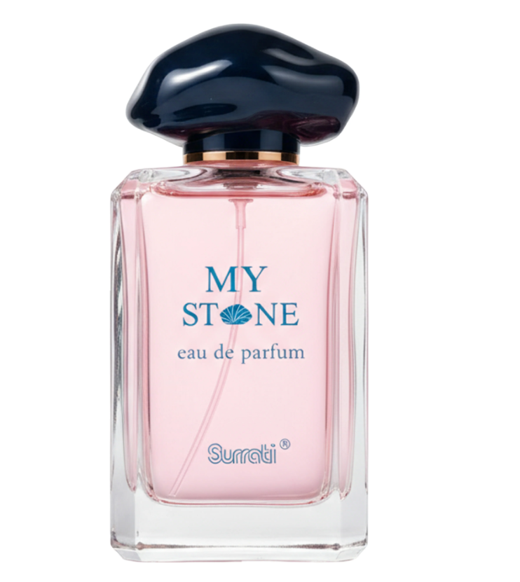 A bottle of Surrati My Stone Eau de Parfum with pink liquid inside a clear glass bottle, featuring a glossy dark blue mushroom-shaped cap and blue lettering on the front.