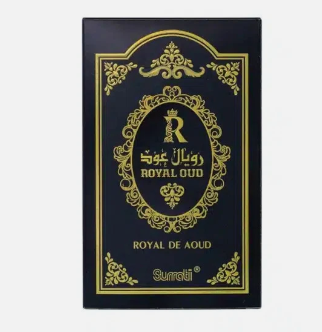 A rectangular black box with ornate gold detailing, featuring the brand name 'Surrati' and 'ROYAL OUD / ROYAL DE AOUD' in gold lettering, shown against a plain light gray background.