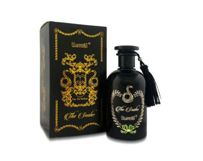A black perfume bottle with a black tassel next to its matching black and gold box, labeled 'Surrati The Snake Eau De Parfum'.