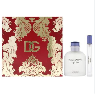 Dolce & Gabbana Light Blue Eau de Toilette set featuring a red and gold damask-patterned box, a frosted glass bottle with a blue cap, and a matching travel spray vial on a white background.