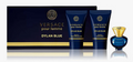 Versace pour femme Dylan Blue fragrance gift set featuring a dark blue box, two matching body care tubes, and a blue-and-gold perfume bottle on a white background.