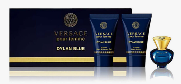 Versace pour femme Dylan Blue fragrance gift set featuring a dark blue box, two matching body care tubes, and a blue-and-gold perfume bottle on a white background.