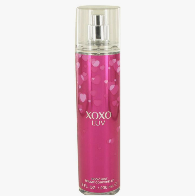 XOXO LUV body mist in a clear cylindrical spray bottle with a bright pink label featuring white heart patterns and silver text, shown on a plain white background.